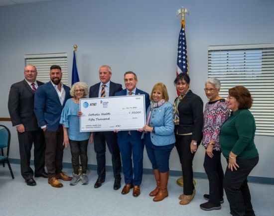 group photo with large check