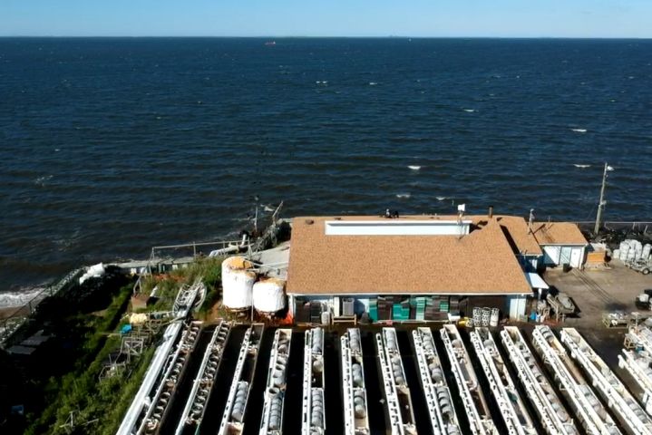 An aerial view of the Shellfish Cultivation Facility, extending right out onto the shore of the Great South Bay.