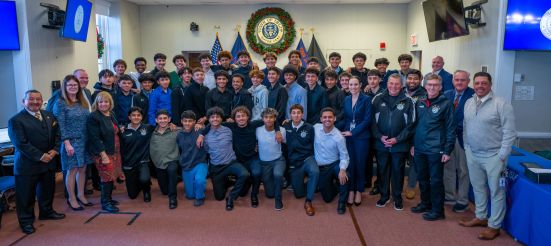 wide shot of brentwood state champs soccer team with elected officials