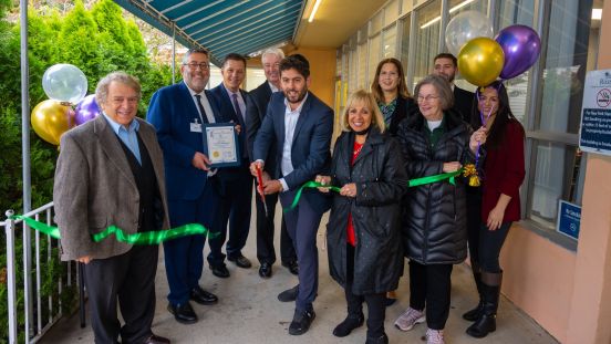 Ribbon Cutting being cut with Supervisor