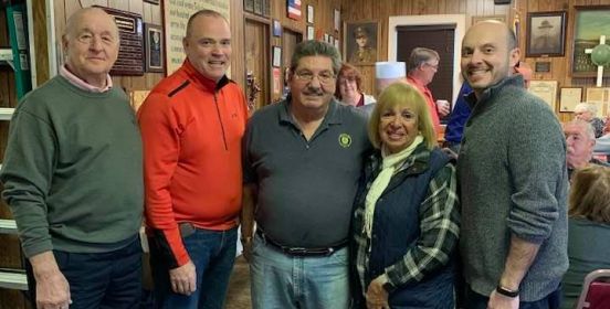  Islip Supervisor Angie Carpenter and Town Councilman O'Connor posing for a photo with legion members.